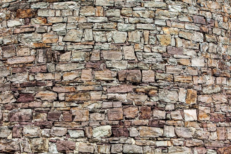 Old walls built with red sandstone from the Weserbergland, Krukenburg Castle, Helmarshausen, Bad Karlshafen, Hesse, Germany