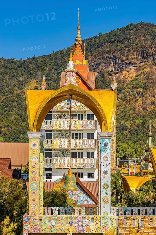 Bell tower decorated with mosaic and glass works of art, Buddhist temple complex Wat Phra That Sorn Kaew, Phetchabun province, Thailand