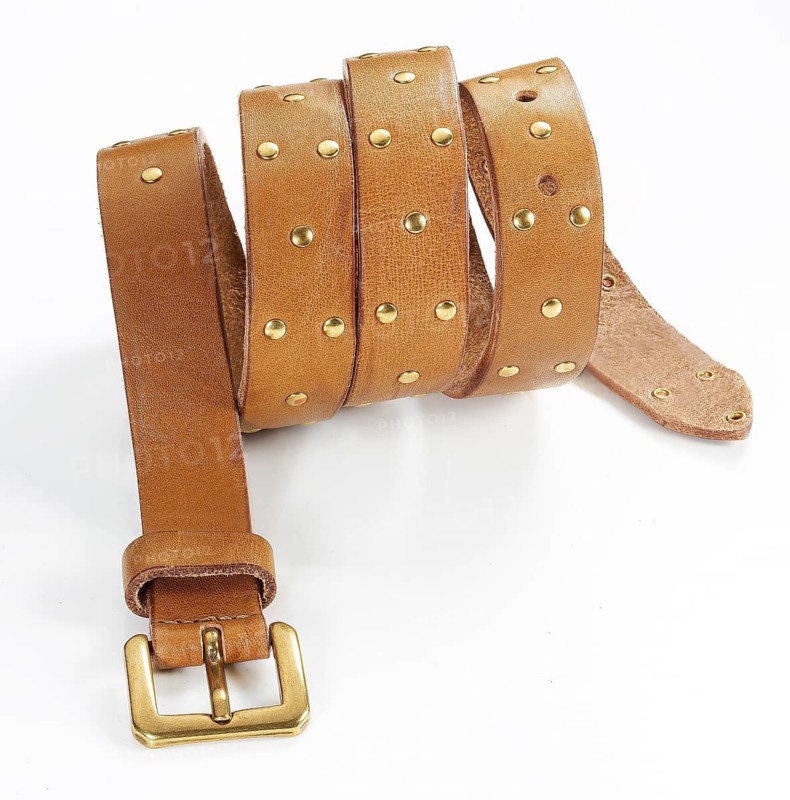 Leather belt in front of a white background, studio shot