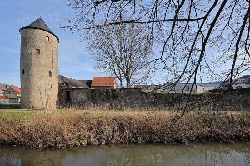 Historic mill tower with city wall on the stream, city fortifications, Dieburg, Hesse, Germany