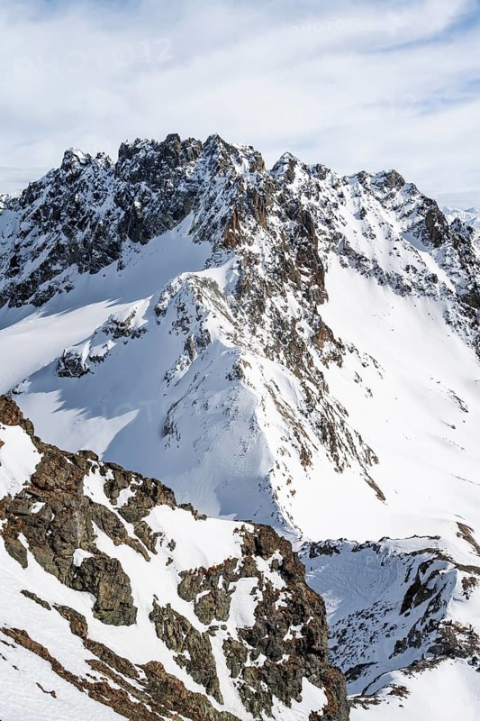 View at the summit of Piz Grialetsch in winter, with summit of Piz Vadret with snow, Grisons Haute Route, Albula Alps, Rhaetian Alps, Grisons, Switzerland