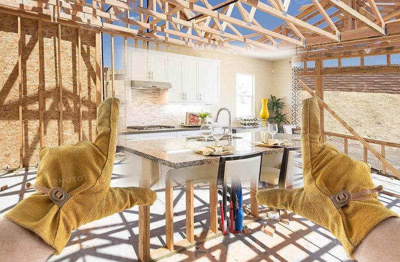 Male Contractor Hands Framing Completed Section of Kitchen Being Built