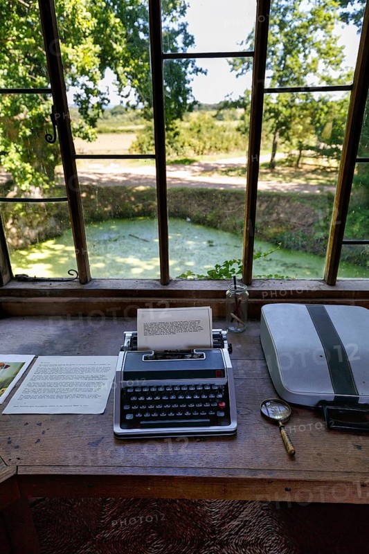 Typewriter with written text, desk in a pavilion overlooking the garden and moat, Sissinghurst Castle and Garden, Cranbrook, Kent, England, Great Britain
