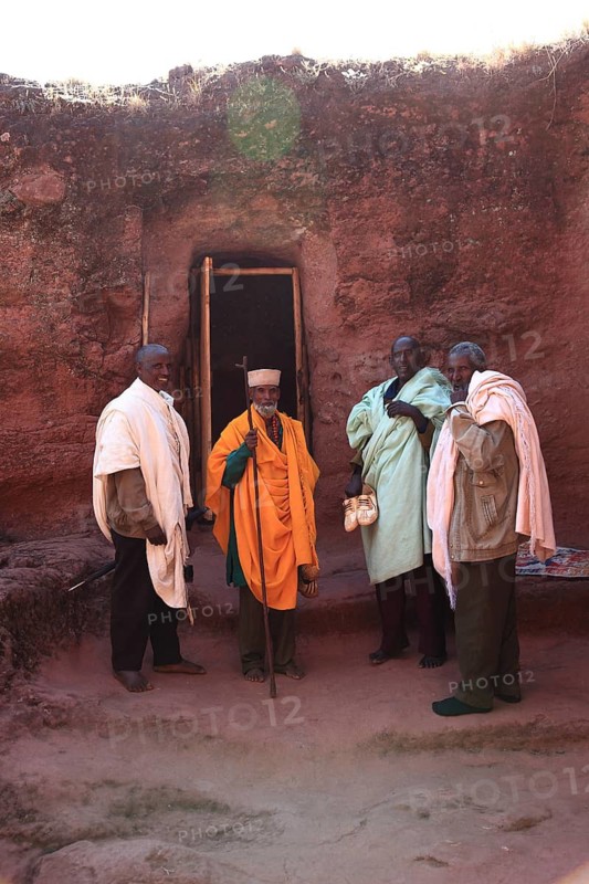 Lalibela, at the eastern group of rock-hewn churches, pilgrims at the double church of Gabriel-Raphael, Pray Gabriel-Raphael, Ethiopia