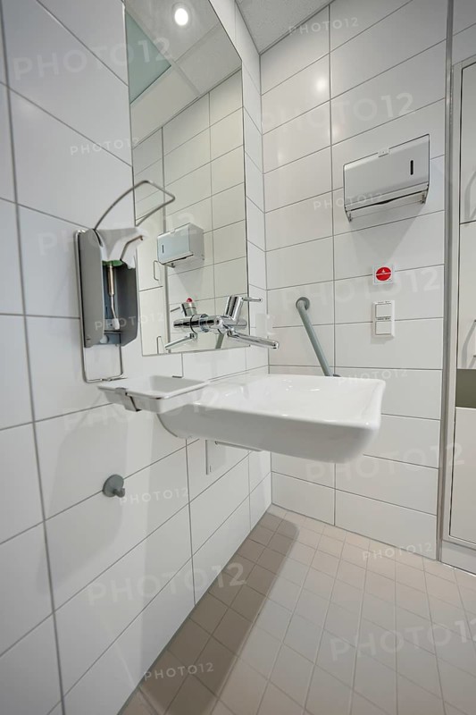 Modern hospital bathroom with sink and sterile tiled design, patient room cash desk in the new Calw hospital, Black Forest, Germany