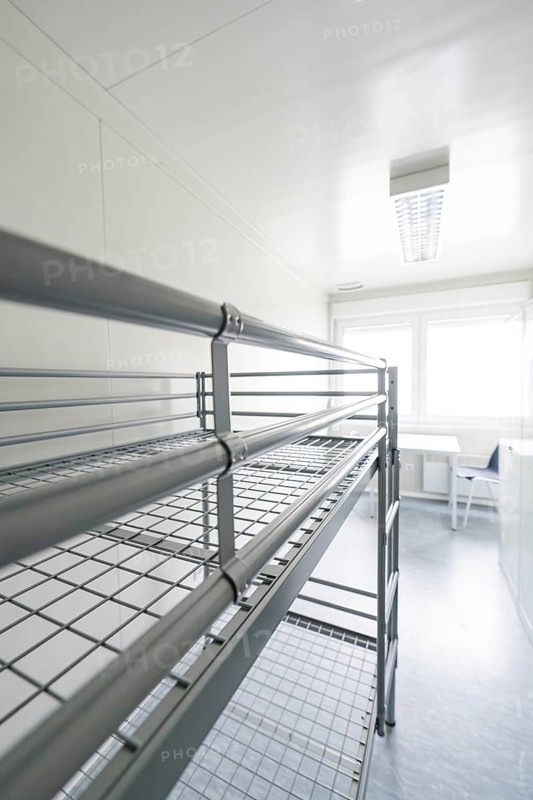 Simple room with a metal bunk bed and lots of natural light, Beermiß refugee accommodation, Calmbach, Black Forest, Germany