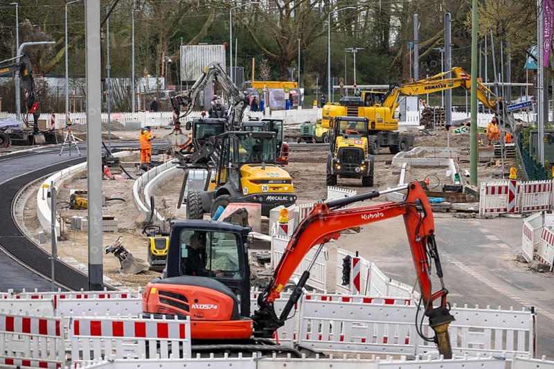 Large construction site in the city center of Essen, the large intersection of Hollesstraße and Steeler Straße is being completely rebuilt and renovated, supply lines, sewage, gas, water and the construction of new road infrastructure and new tracks for the new Stadtbahn-Essen, a new tram line in the city center, North Rhine-Westphalia, Germany