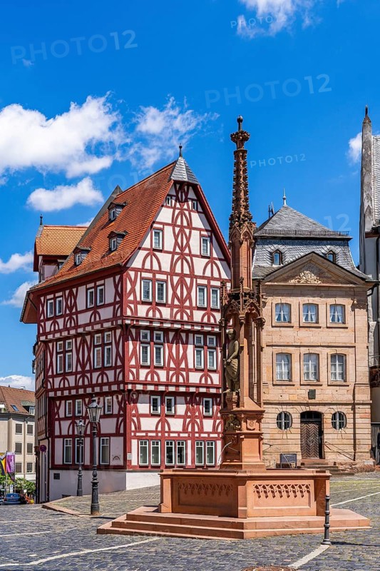 Abbey fountain, reconstructed half-timbered building of the Löwenapotheke and historic Stiftsglöcknerhaus on Stiftsplatz, Aschaffenburg, Lower Franconia, Bavaria, Germany