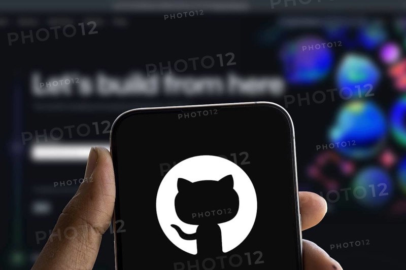 github logo is displayed on smartphone. GitHub is a proprietary developer platform