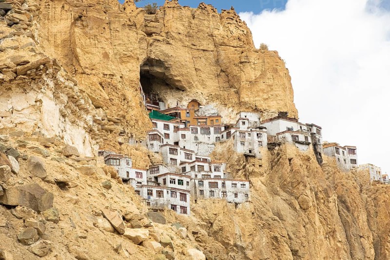 Phugtal Monastery, nestled in the cliffs of the Lungnak Valley, Ladakh, India, stands as a unique Buddhist retreat offering stunning views of the surrounding rugged landscape