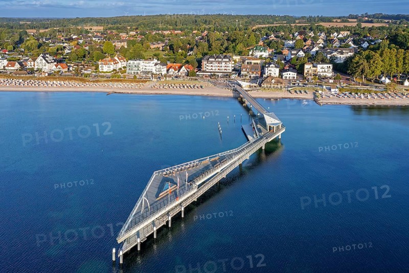 Aerial view over Seebrücke, pier and sandy beach at seaside resort Haffkrug along the Baltic Sea, Scharbeutz, Schleswig-Holstein, Germany