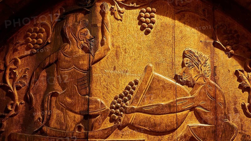 Detailed wood engraving on a wine barrel with antique art style, Achaia Clauss winery, Patras, Peloponnese, Greece