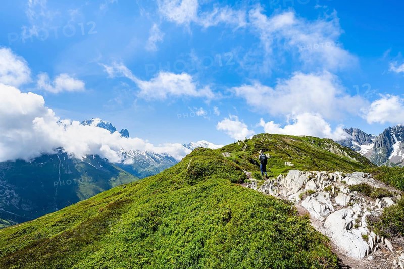 Mountaineers on a hiking trail with mountain views, hiking to the Aiguillette des Posettes, Chamonix, Haute-Savoie, France