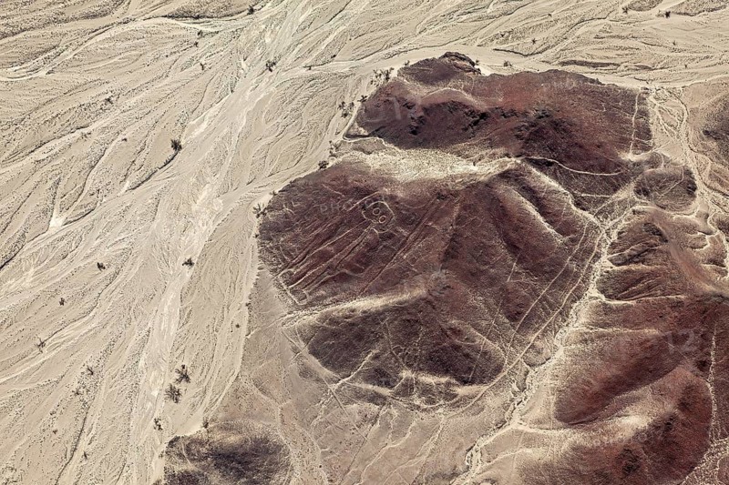 Barren desert landscape with registrable geoglyphs from the air, the geoglyphs and images in the desert near Nasca and Palpa in Peru