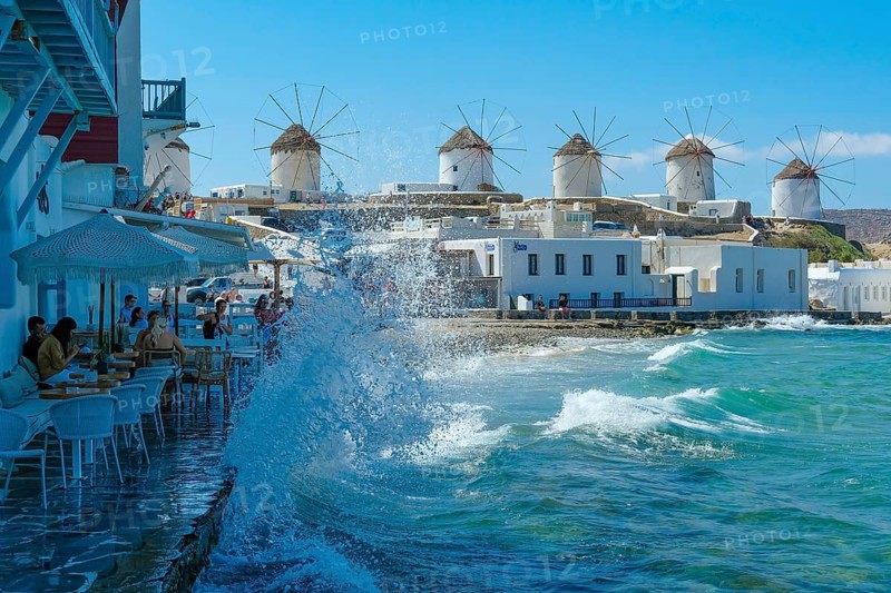 Mykonos, Cyclades, Greece - The six sixteenth-century windmills, lined up on a hill above Mykonos Town, Mykonos Chora, are the island's landmark. Mykonos is part of the Cyclades archipelago in the Aegean Sea