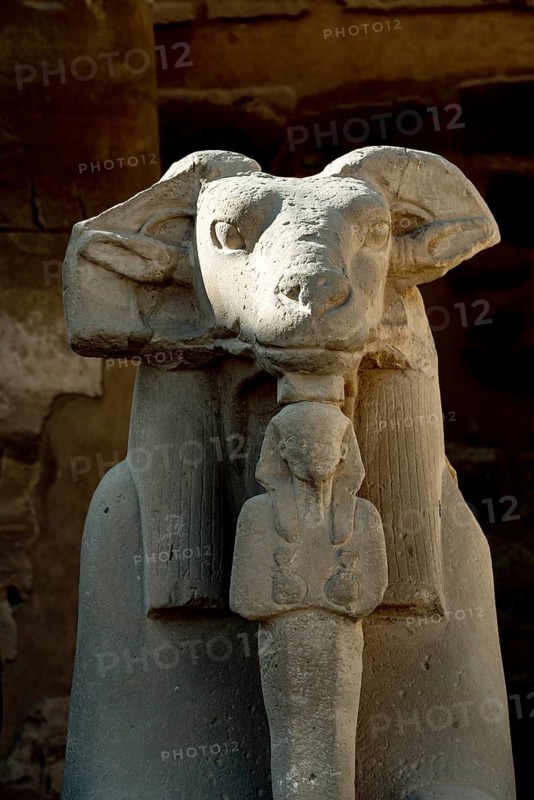 At the entrance to Karnak Temple the Avenue of Sphinxes, statues with the head of a Ram and the body of a Lion, ancient Egyptian icons and symbols to the Gods dating from the 30th Dynasty. Ancient Egyptian archaeology in Luxor, Egypt
