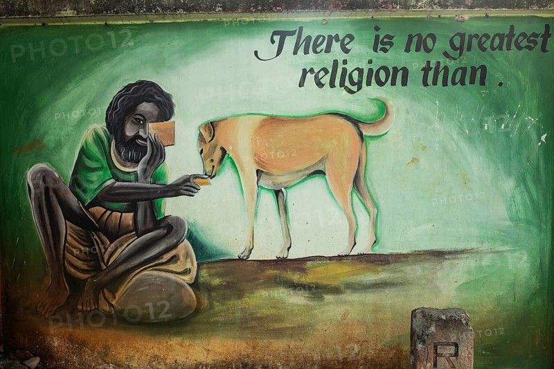 Mural painting depicting a poor man feeding a stray dog (Odisha, India), mural promoting animals rights