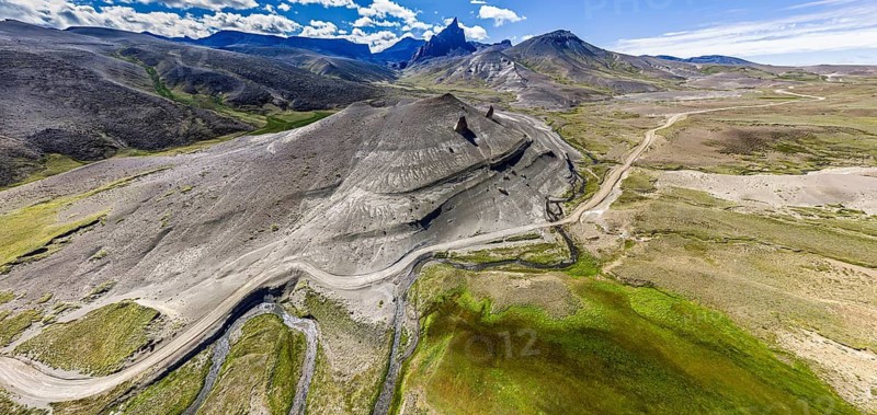 Road Ruta 41, gravel road, arid landscape, Mt. Cerro Boleadoras, volcano-shaped rock formation, Los Antiguos - Paso Roballo, aerial view, Argentina