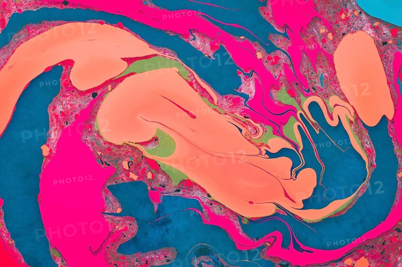 An abstract image featuring vivid swirls of pink and blue with hints of green and orange, creating a visually engaging mixture of colors
