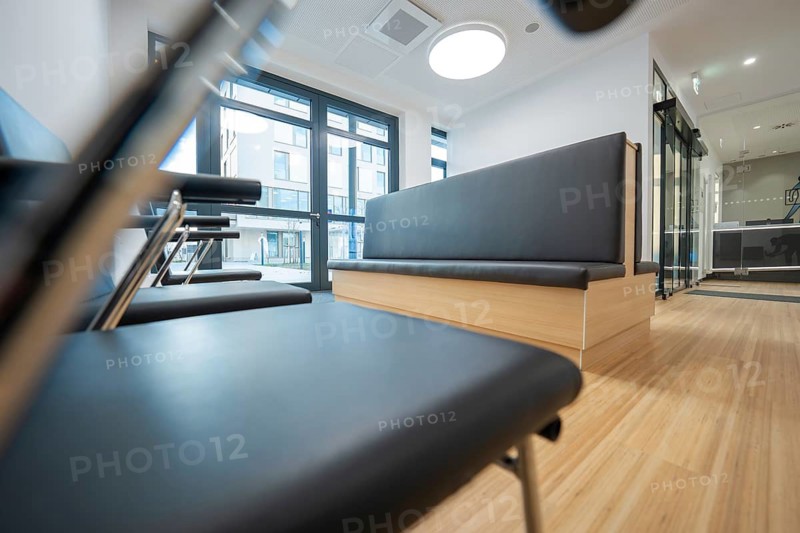 Modern waiting room with chairs, a bench and large windows, radiology in the new health campus, Calw, Germany