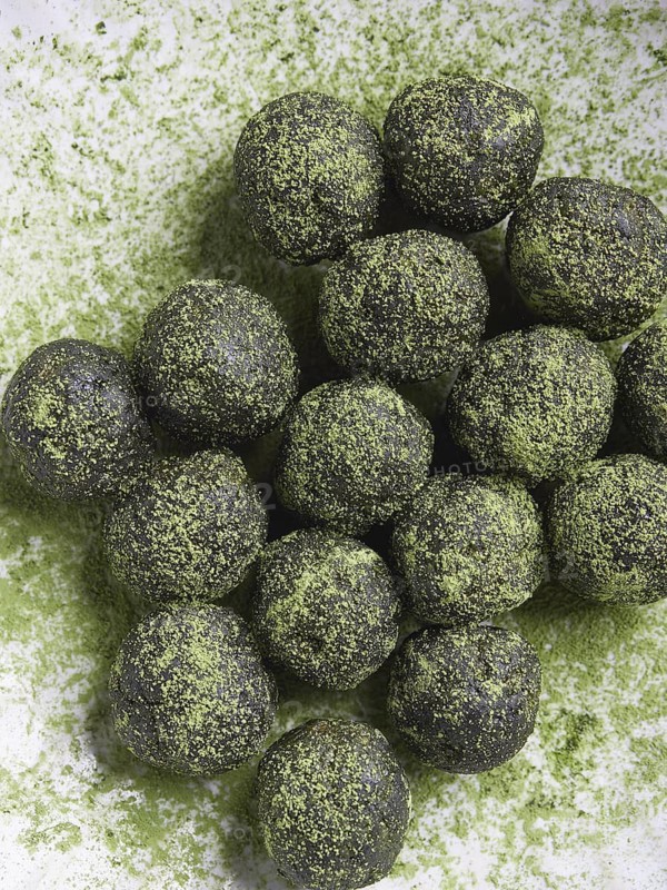 Green tea matcha truffles or bliss balls. Energy balls. Healthy raw desserts. Top view