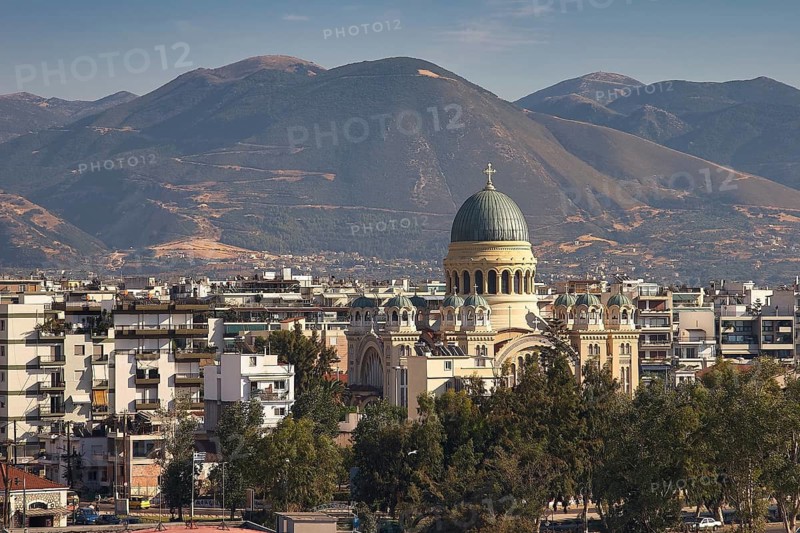 Church in the middle of an urban landscape with mountains in the background, Old ferry port in the center of Patras, Ferries, Patras, Peloponnese, Greece