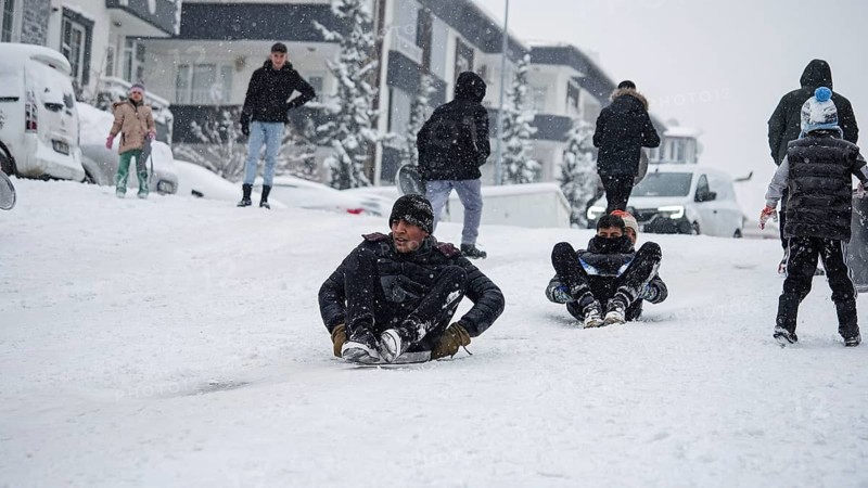 In Gaziantep, Turkey, on December 31, 2025, children and families enjoy winter activities as they play on snow-covered areas and slide on icy hills, creating a lively atmosphere across the city during the final day of the year, Gaziantep, Gaziantep, Turkey