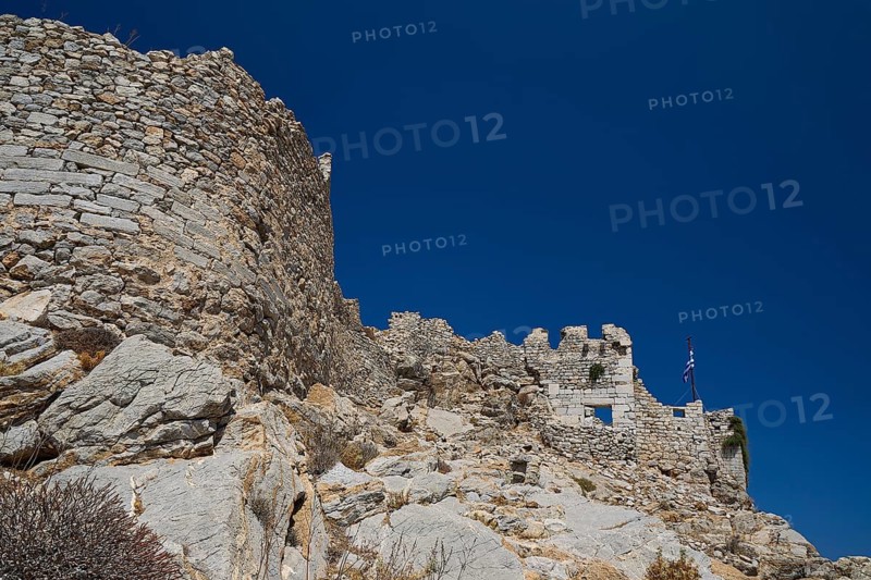 Old, stony fortress walls from the past, surrounded by rocky landscape, Johanniter fortress from the 14th century AD, fortress of Megalo Chorio, Kastro, Megalo Chorio, Zero Waste Island, Tilos, Dodecanese, Greek Islands, Greece