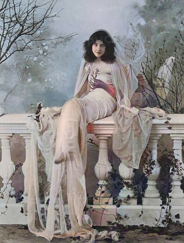 Beautiful dark-haired woman with a veil sitting on a ballustrade on the terrace, 1880, Italy, Historic, digitally restored reproduction of a 19th century original