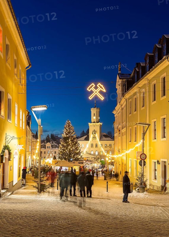 Christmas market with town hall and Christmas tree at the blue hour in Schneeberg, Erzgebirge, Saxony, Germany