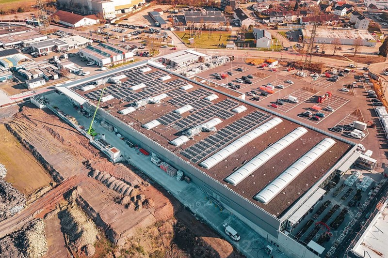 Industrial area with large buildings, solar systems and construction activities, PV Bau Auf OBI Bau Markt, Mühlacker, Enzkreis, Germany