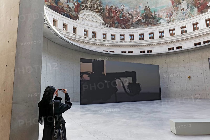 Bourse de Commerce, Pinault Collection, visitor photographed in the historic rotunda, concrete cylinder by architect Tadao Ando, Paris, France