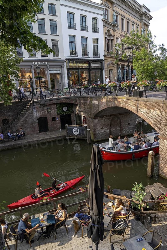 The old town centre of Utrecht, Oudegracht, around 2 km long with many old houses, shops, restaurants directly on the canal, many bridges, boat traffic of all kinds, Netherlands