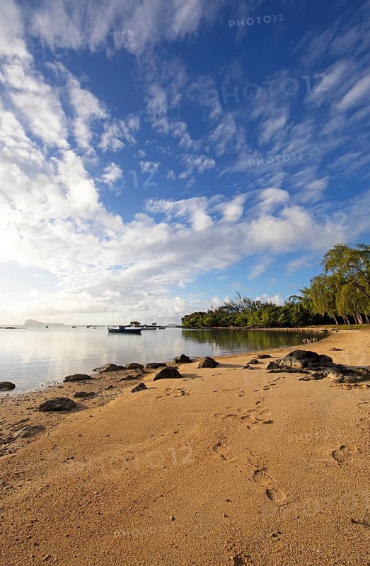Golden sandy beach on the Indian Ocean near Calodyne, with Gunner's Coin Island in the background, Riviere du Rempart district, Mauritius