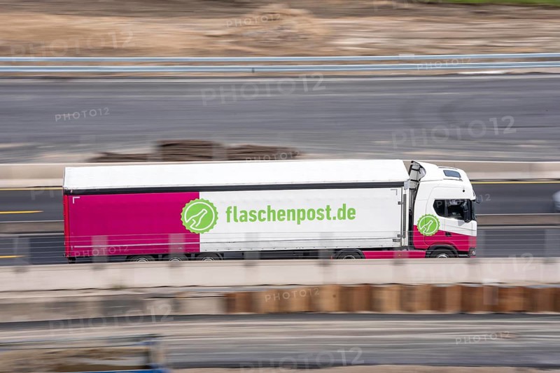 Freight truck for food logistics, on the highway, drinks and food delivery service Message in a bottle