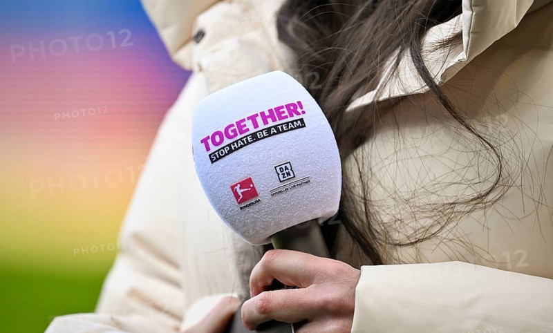 Feature detailed shot microphone logo DAZN held by DAZN presenter reporter Ann-Sophie Kimmel action day TOGETHER Stop Hate soccer Bundesliga, Voith-Arena, Heidenheim, Baden-Württemberg, Germany