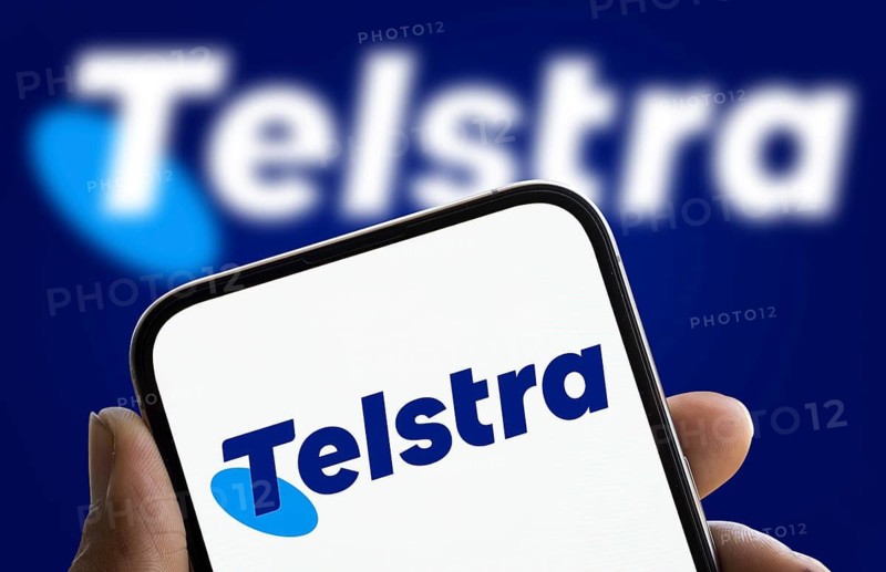 Telstra logo is displayed on smartphone. Telstra Group Limited is an Australian telecommunications company
