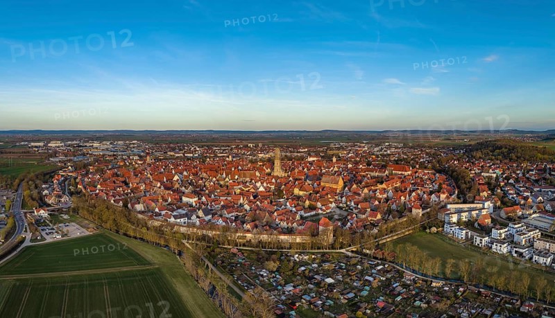 Aerial view, panorama of the historic old town of Nördlingen with the completely comprehensive and accessible city wall, in the town center the church of St. Georg with the 90-meter high church tower, called Daniel, Donau-Ries district, Nördlinger Ries, Bavaria, Germany