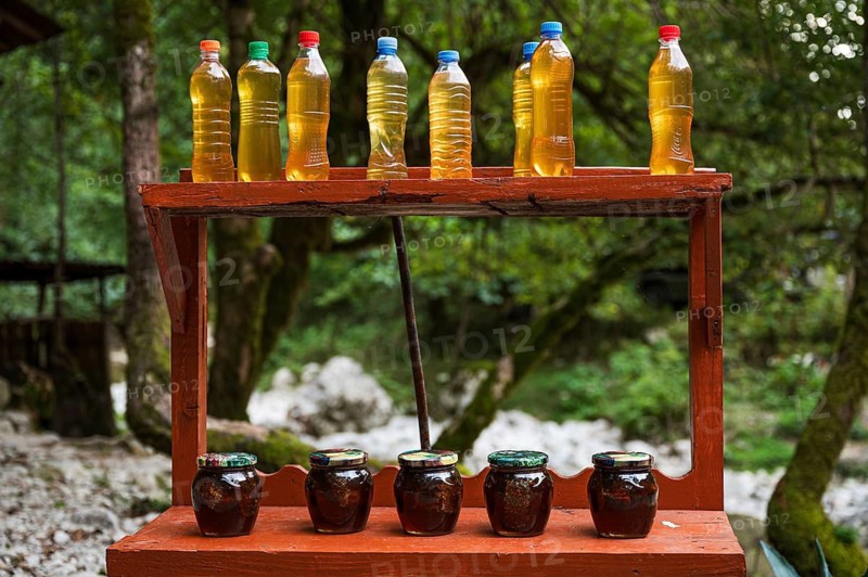 MARTVILI, GEORGIA - AUGUST 21, 2023: a stall with local products chacha and syrup from cones