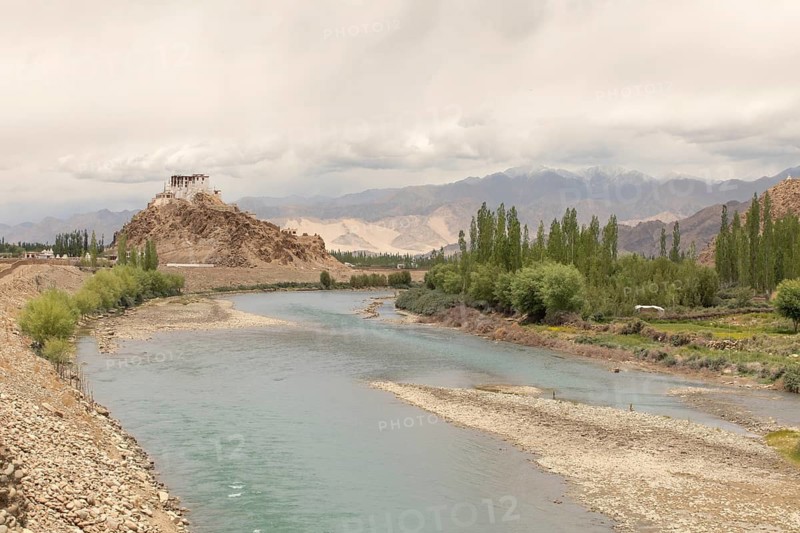 Stakna Monastery perched on a hill by the serene Indus River in Ladakh, India. Set against the majestic Himalayas, this ancient Buddhist site is a symbol of spiritual tranquility