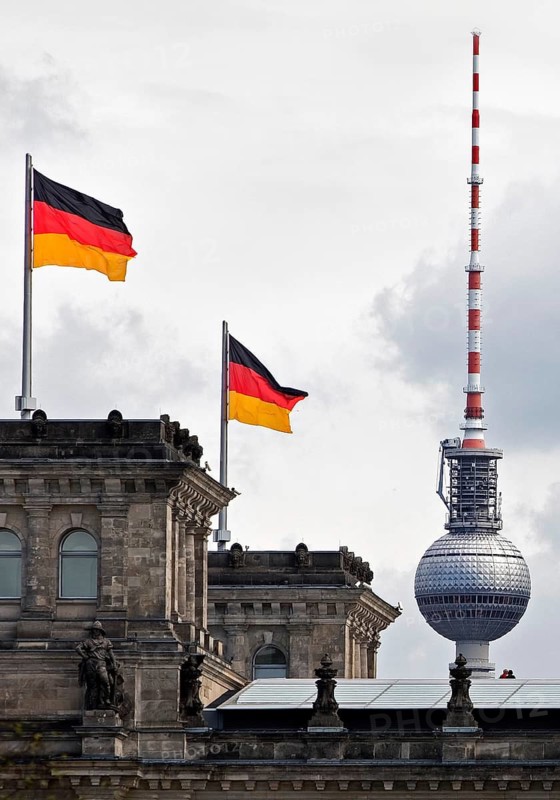 Reichstag, detail with German flags and Berlin television tower, German Bundestag, government district, Berlin, Germany