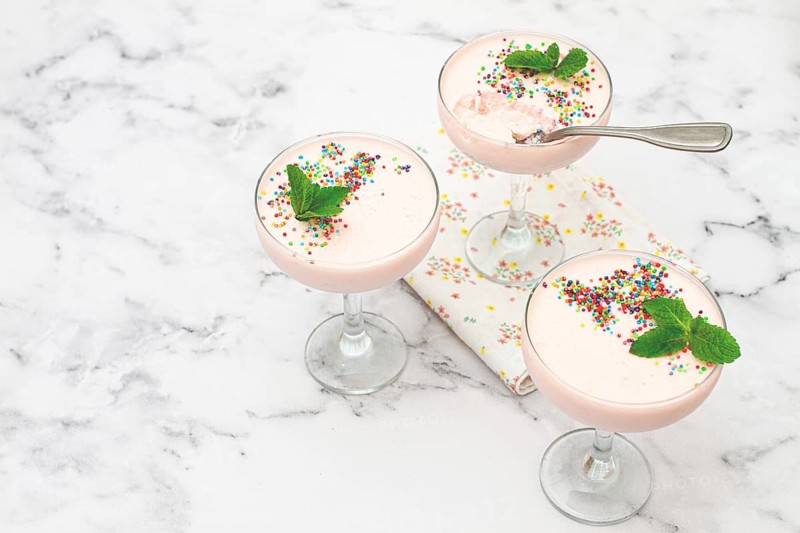Fruit mousse, made from jelly and cottage cheese, in glasses, decorated with sprinkles and mint, homemade
