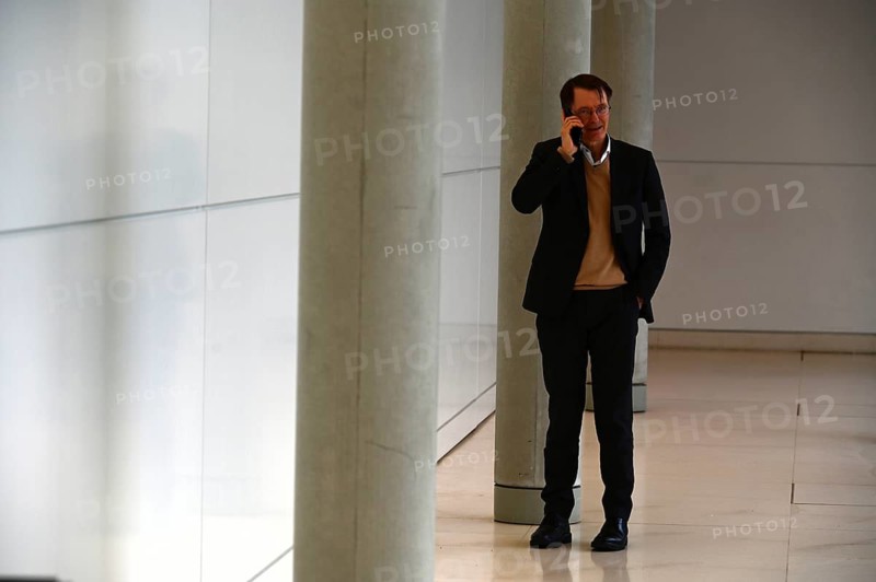 Karl Lauterbach (SPD) on the phone in front of the SPD parliamentary group meeting room