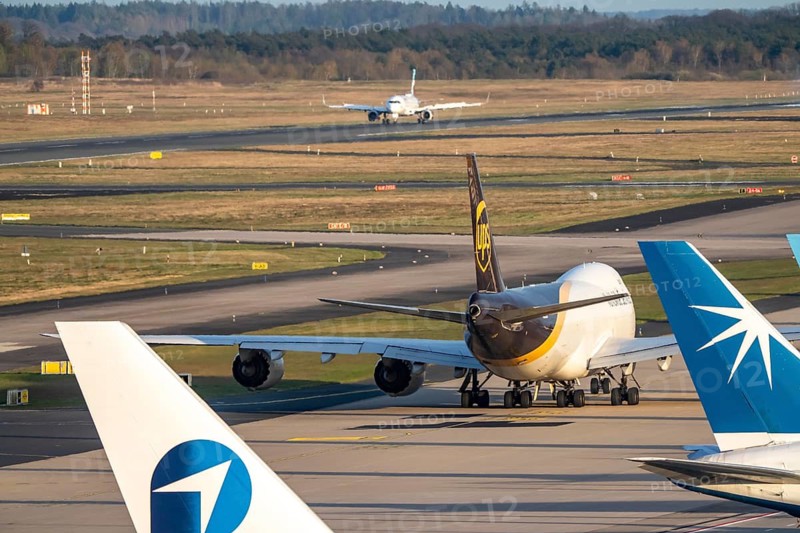 Cologne-Bonn airport, CGN, UPS Boeing 747-8F, cargo plane after landing, on the taxiway to the air freight center, UPS Logisic Hub, Star Air, Maersk cargo planes on the apron
