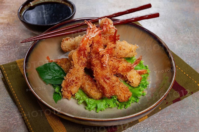 Shrimp in tempura, deep fried, with soy sauce, close-up, top view, without people