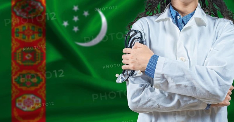 Healthcare professional with Turkmenistan flag background. Professional doctor holding stethoscope on Turkmenistan flag background