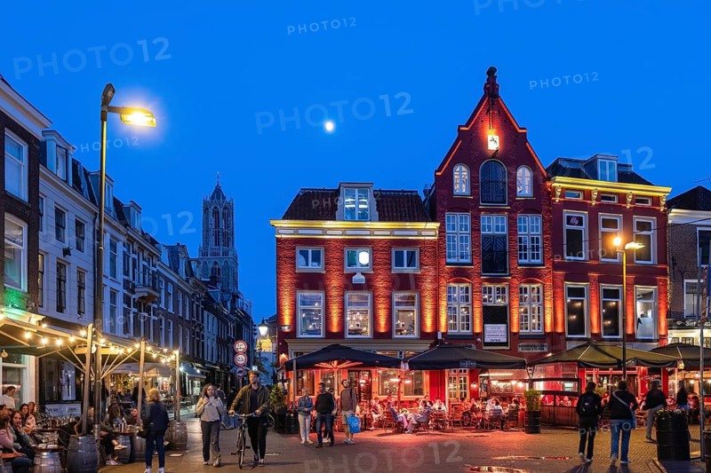 Nightlife at De Neude square in the background the bell tower of the cathedral in the historic centre of Utrecht, Netherlands