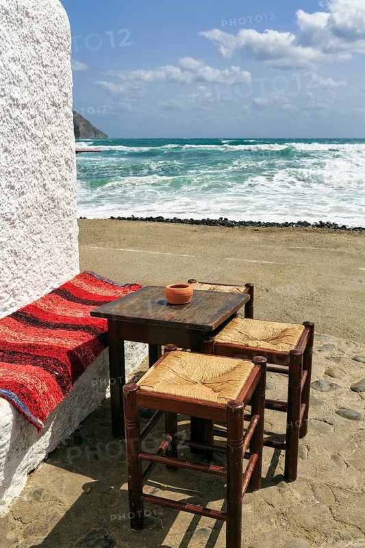 Simple wooden table with bench and stools outdoors, bar, beach bar with sea view, Cabo de Gata Natural Park, Cabo-de-Gata-Nijar, Las Negras, Almeria, Andalusia, Spain