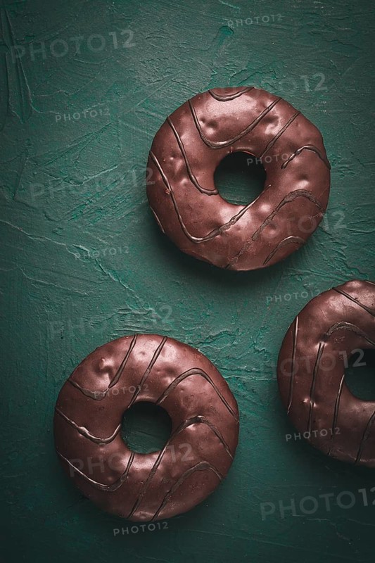 Donuts with cocoa, in chocolate glaze, top view, no people