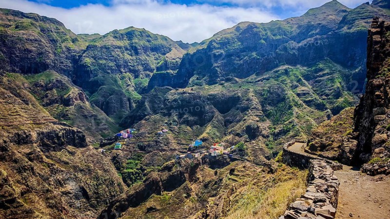 Panoramic view, small settlement, colorful village, picturesque hiking trail nestled in raw, dramatic mountains under blue skies, spectacular hiking, natural heritage, cultural heritage, terraces in Fontainhas, Santo Antao, Cabo Verde, Cape Verde, Cape Verde, Cape Verde